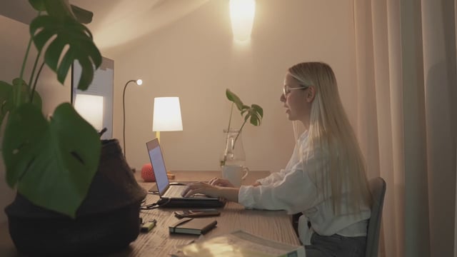 Woman ending a video call on her laptop
