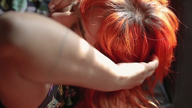 Redhead woman laying in the sun
