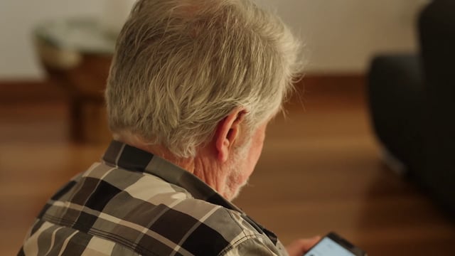 Old man using smartphone