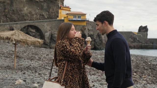 Girl putting ice cream on her boyfriend's face