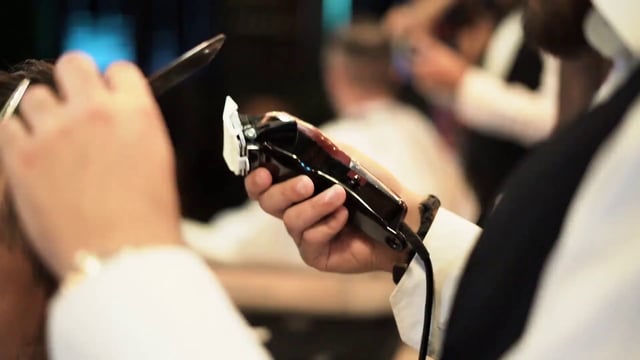 Barber cutting hair 