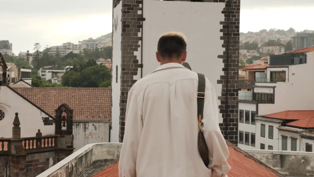 Man walks on a rooftop