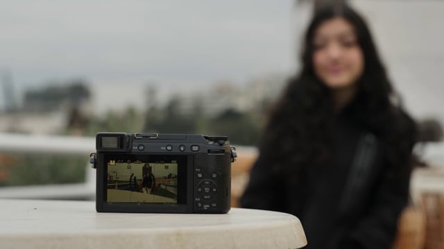 Camera recording a girl talking