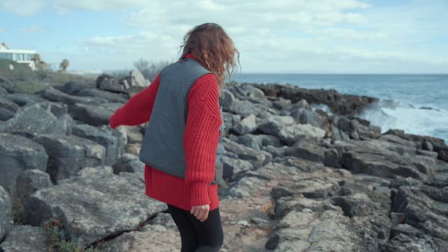 Girl walking on the rocky beach - Free Stock Video| Coverr