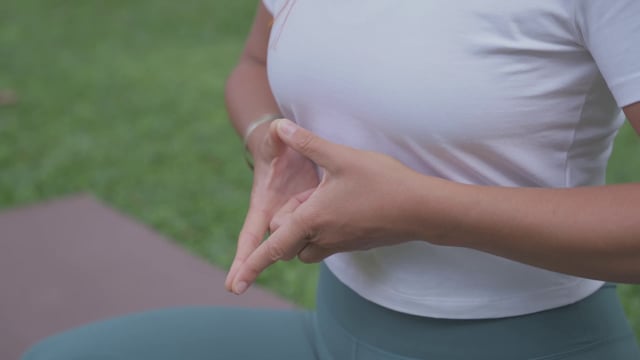 Woman's hands in the soaring lotus mudra formation