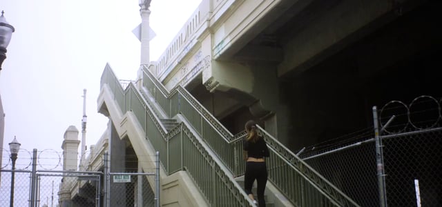 Woman running up steps