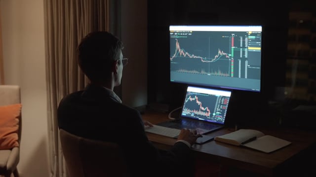A broker works with a cryptocurrency candlestick chart