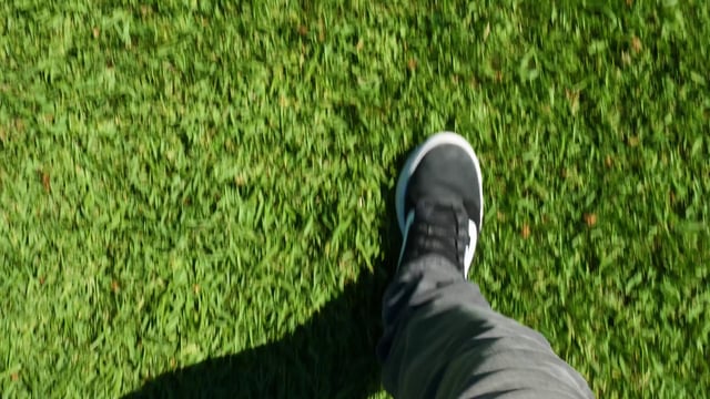 Man walking on grass