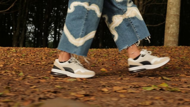 Sneakers walking through a forest