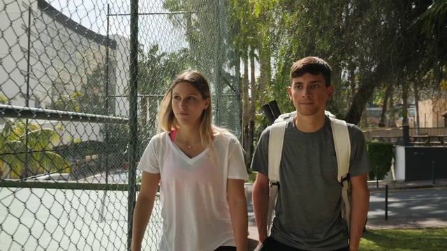 Friends entering the tennis court