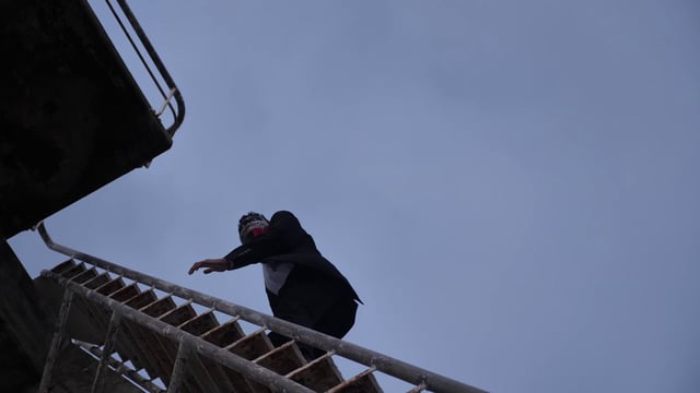 Man climbing up a ladder