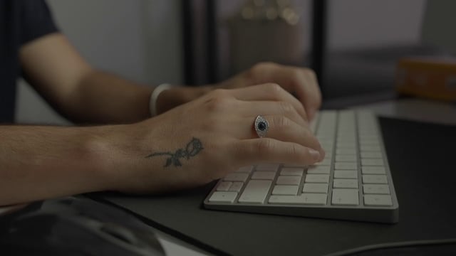 Person typing on a keyboard