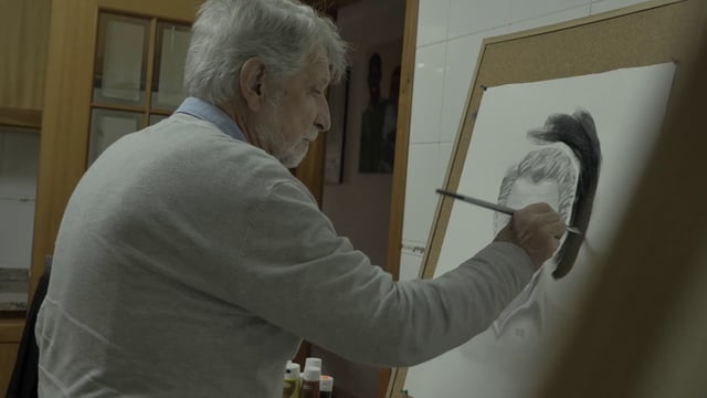 Man painting his self-portrait