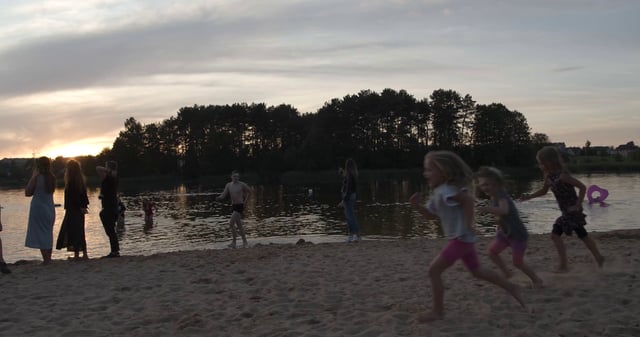 Kids playing at Salote Lake in Vilnius 