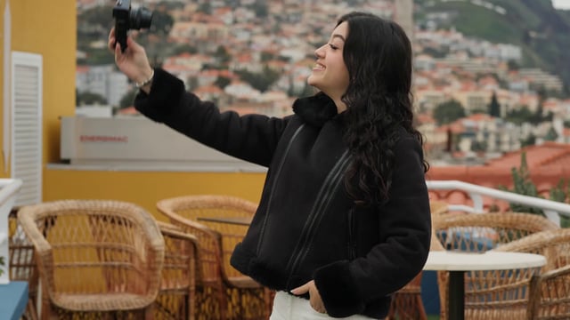 Girl capturing a video with her camera