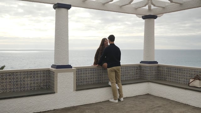 Couple talking near the sea