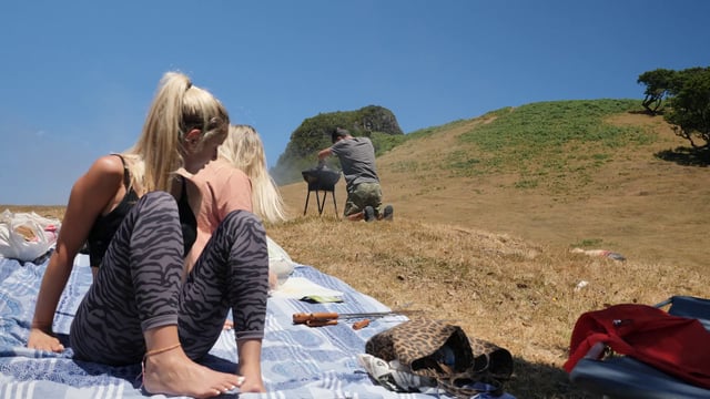 Watching a barbecue on a field