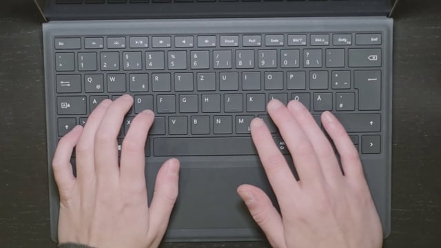 Slow-motion typing on a laptop 