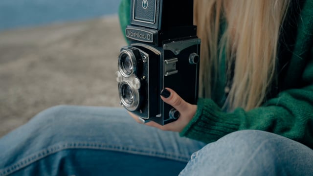 Close-up adjusting a vintage camera