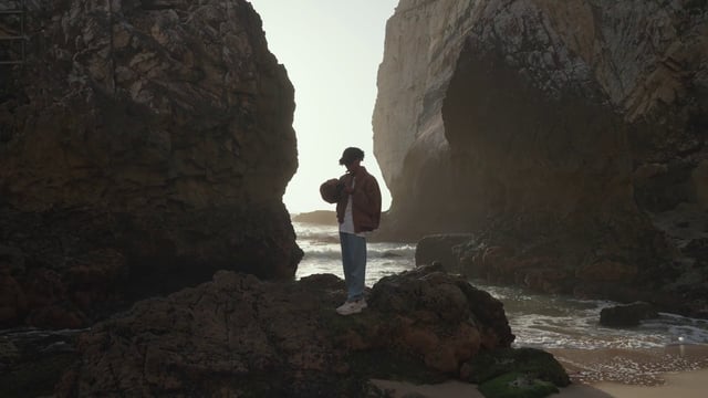 Traveler standing between big rocks