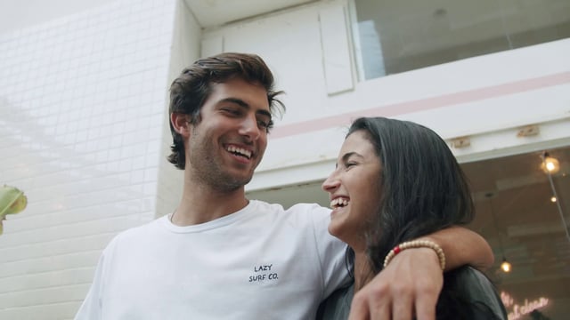 Friends laughing and looking at the camera