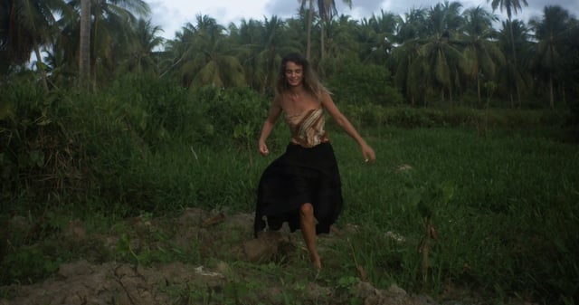 Woman running in the jungle