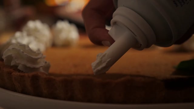 Decorating pie with whipped cream