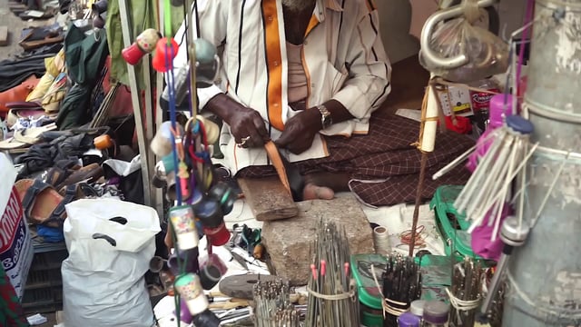 Hand-sewing at the market