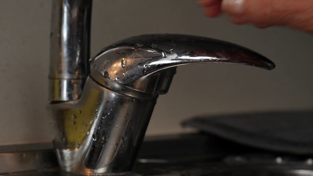 Woman rinsing her hands