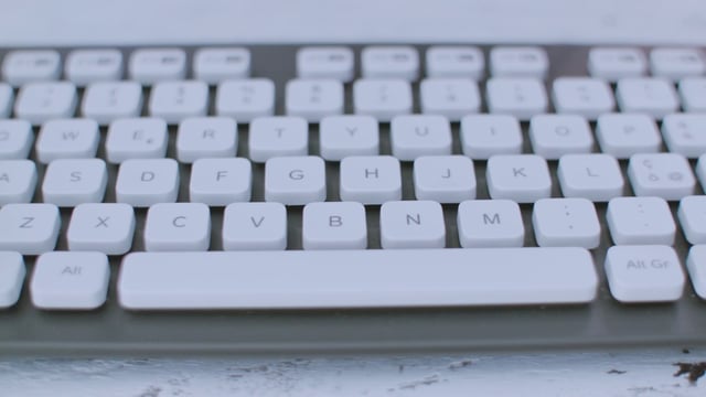 Typing on a white keyboard 