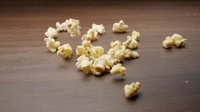 Popcorn falls on a table