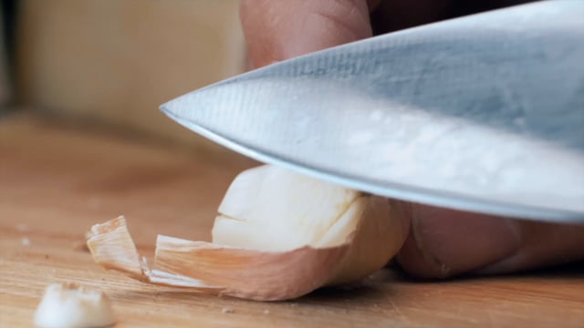 Peeling garlic with a knife