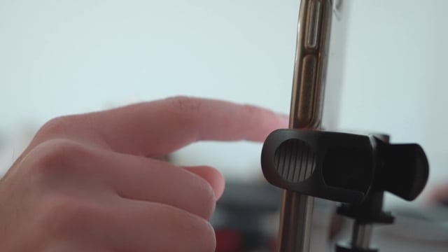 A finger scrolling through a smartphone