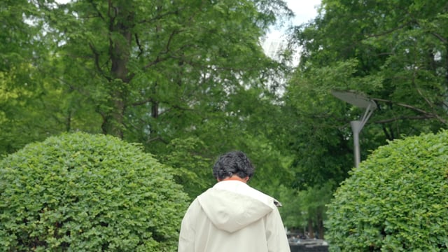 A young man walking in the park