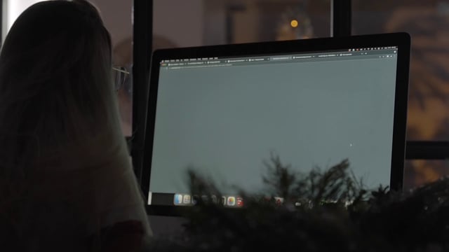A girl downloading a Christmas picture on her computer
