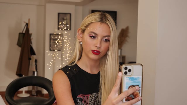 Woman taking a selfie with makeup on