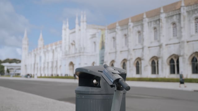 An electric scooter standing near the Jeronimos Monastery