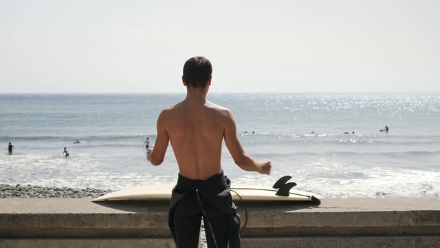 Doing a warm-up before surfing