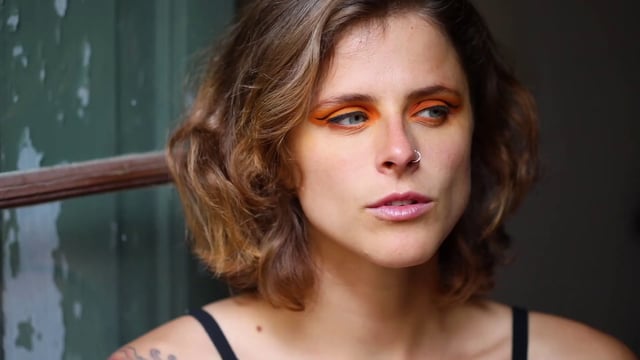 Woman with orange eye makeup