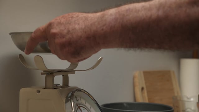 Pouring flour in a bowl