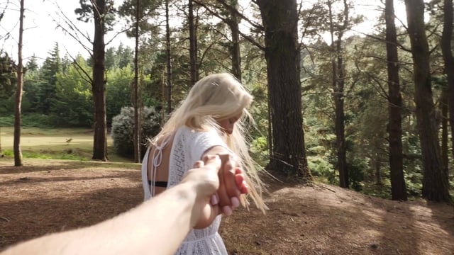 Holding hands in the forest