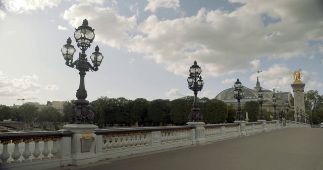 Walking across Pont Alexandre III Bridge