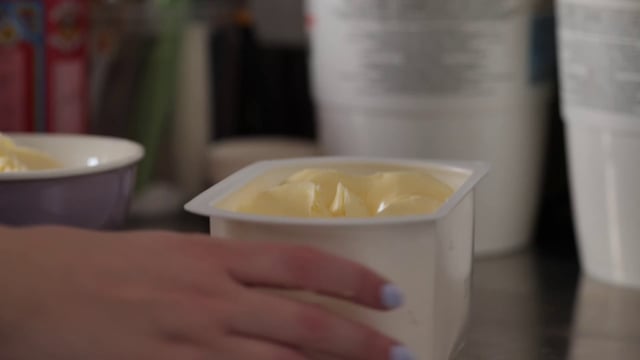 Putting butter into a bowl