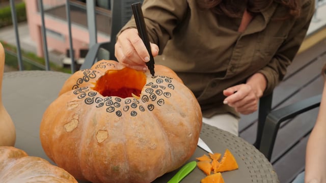 Decorating a pumpkin