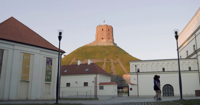 Cycling past Gedinimo Tower in Vilnius