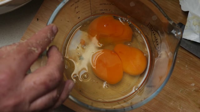 Cracking eggs in a jug