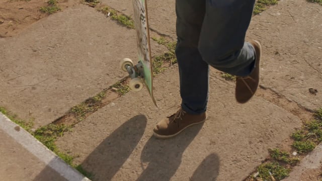 Man going up steps with a skateboard