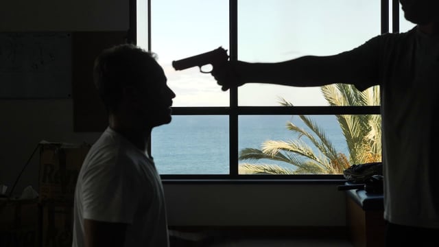 Man at gunpoint grabs the gun