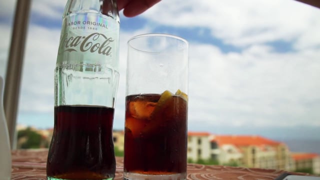 Pouring a glass of Coca-Cola