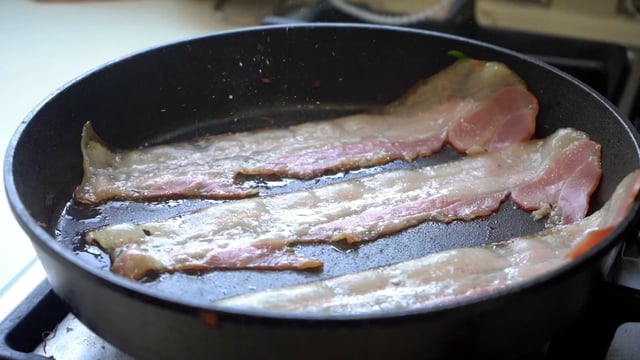 Cooking bacon in a pan